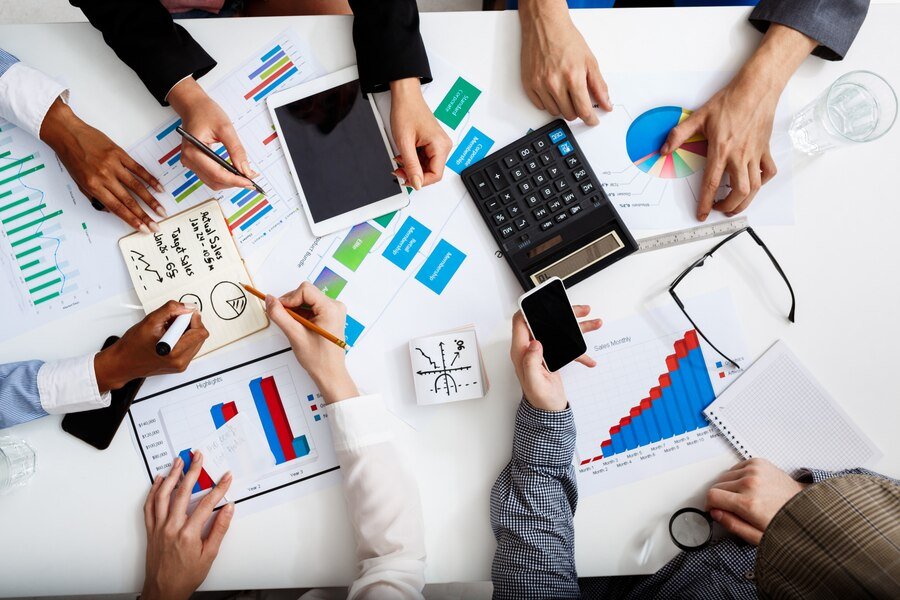 businessmen-hands-white-table-with-documents-drafts_176420-353