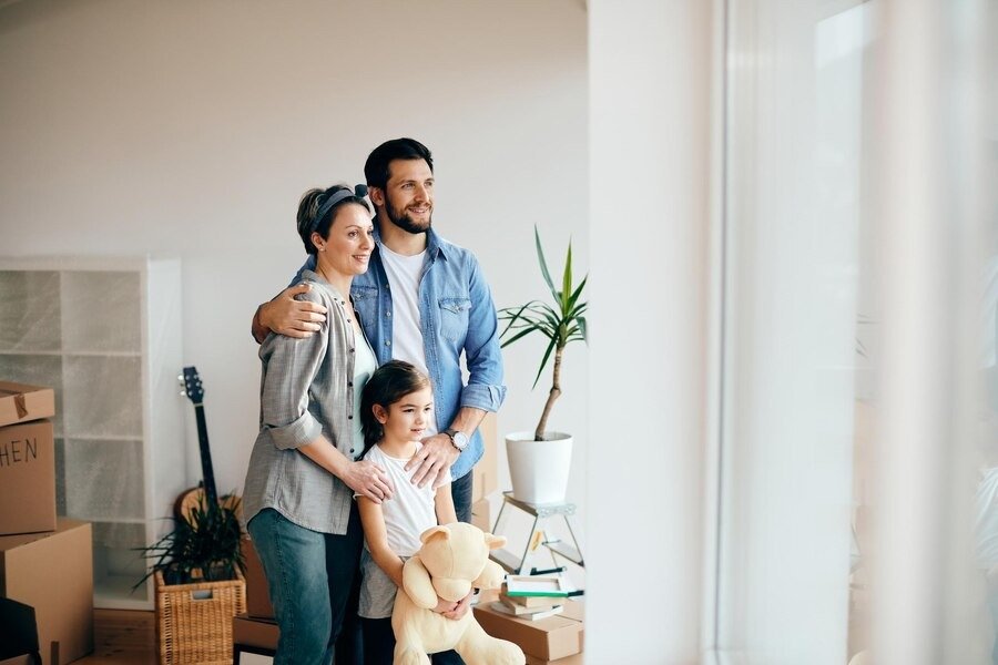 happy-family-looking-through-win