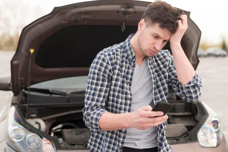 man-with-mobile-broken-car_23-21