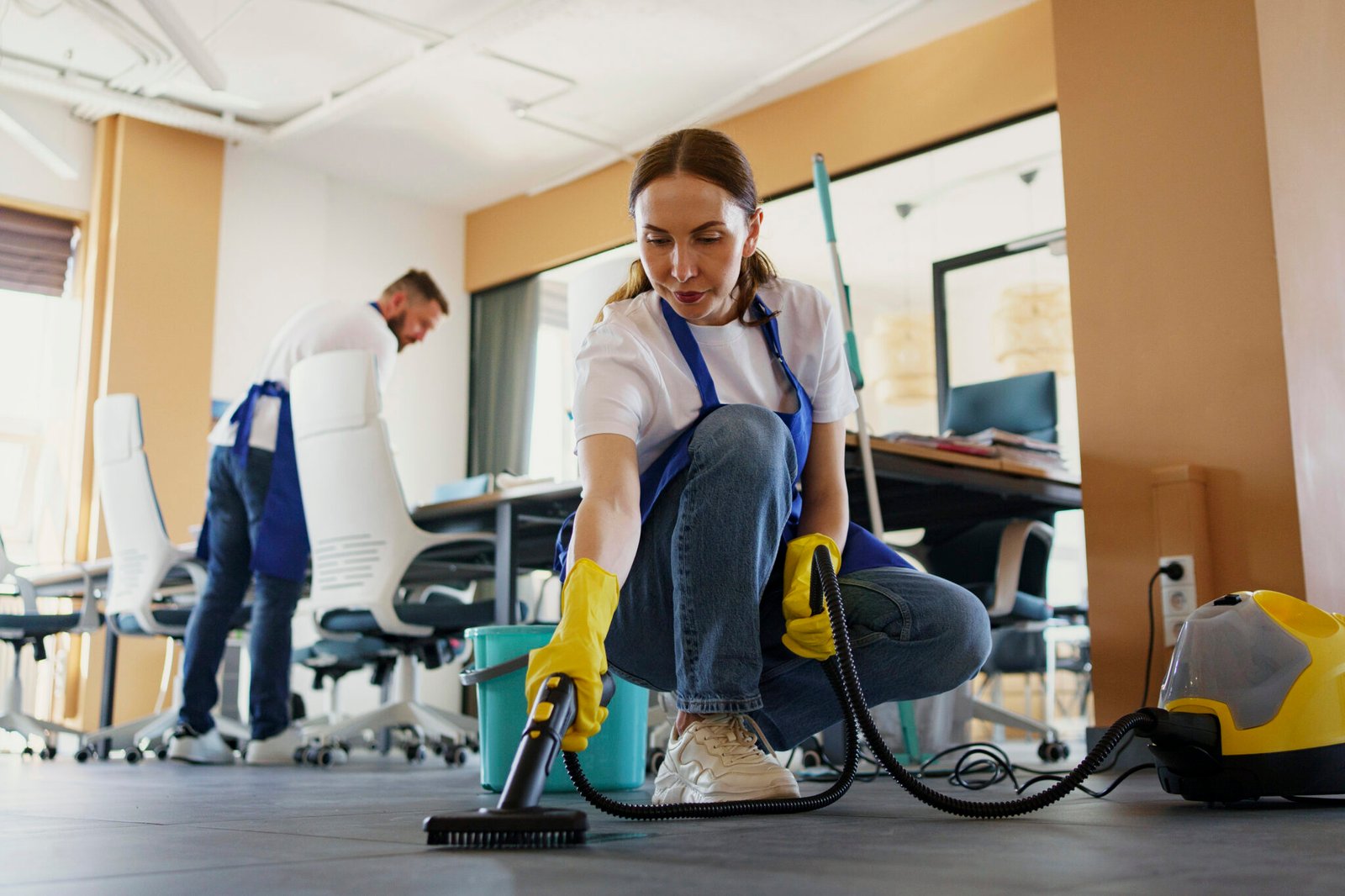 professional-cleaning-service-person-using-vacuum-cleaner-office